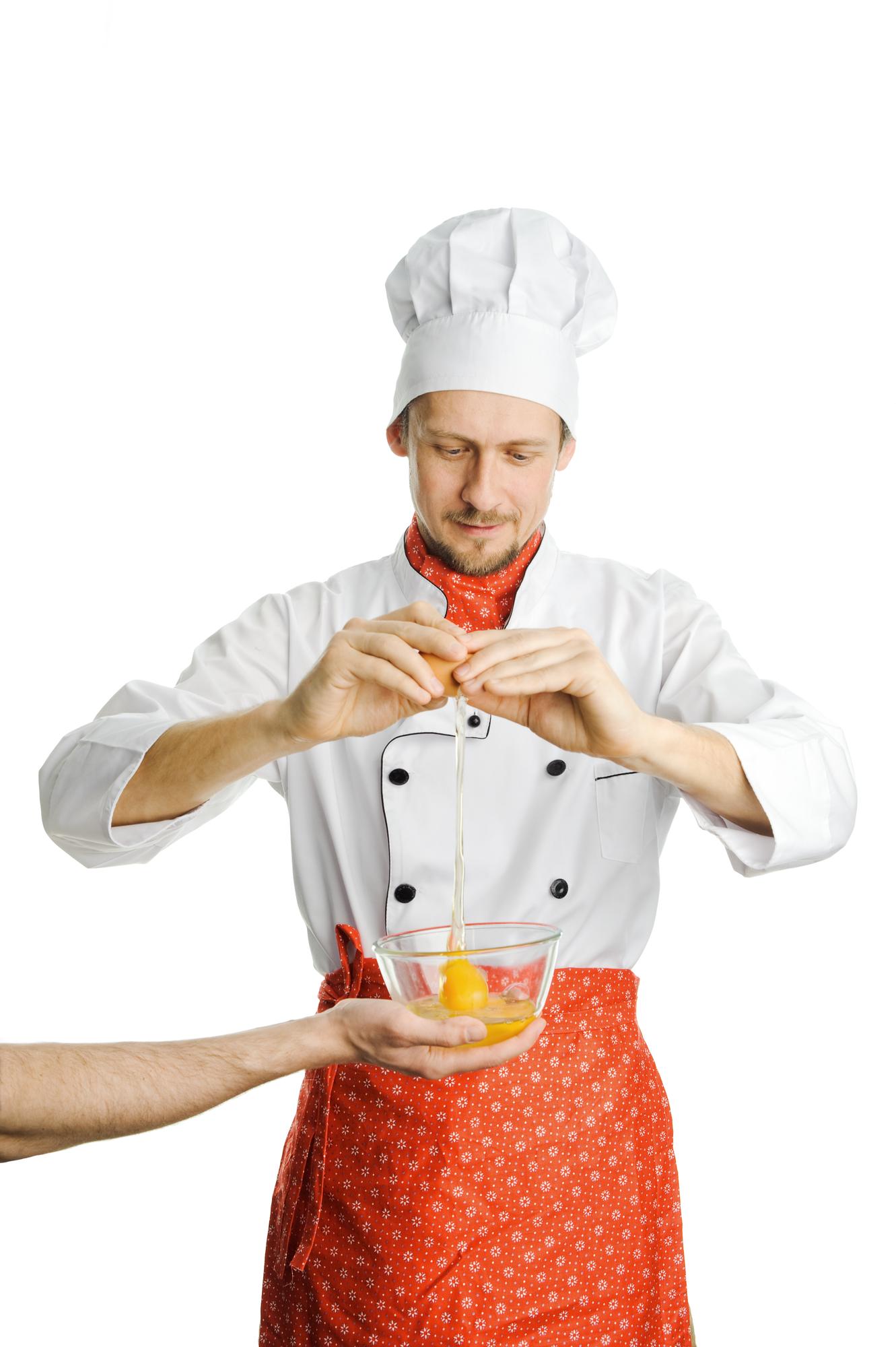 studio chef demonstrating plating in workshop