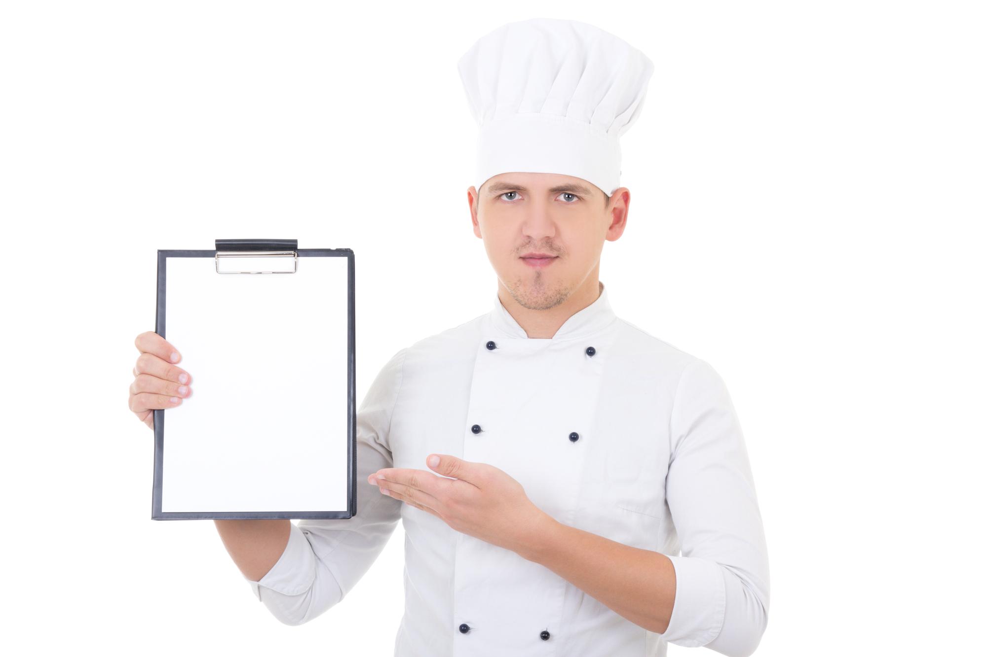 chef composing subscription menu on clipboard